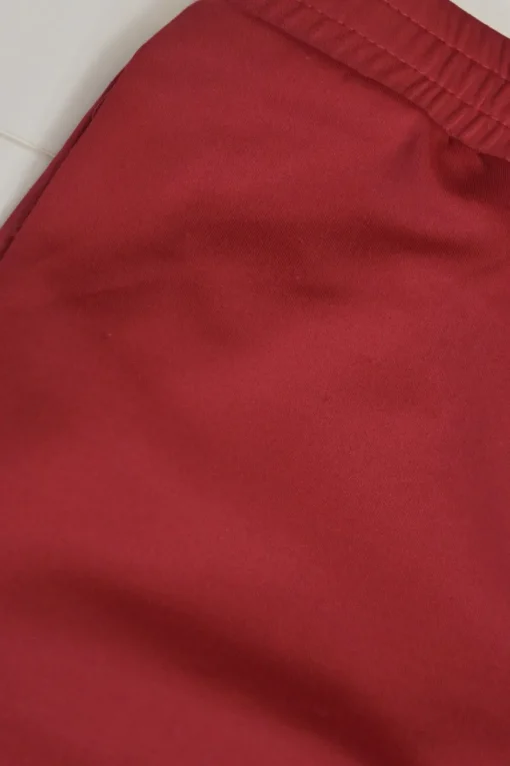 Red polyester-blend two-piece tracksuit with funnel collar zip-up jacket and high-rise wide-leg pants