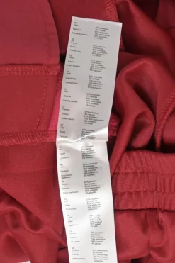 Red polyester-blend two-piece tracksuit with funnel collar zip-up jacket and high-rise wide-leg pants