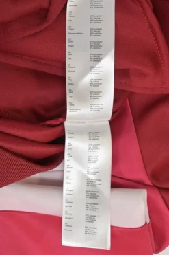Red polyester-blend two-piece tracksuit with funnel collar zip-up jacket and high-rise wide-leg pants