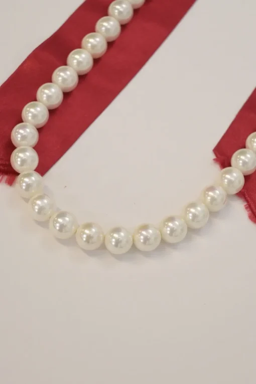 Red satin and faux pearl bead and draped ribbon necklace