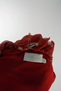 Red semi-sheer crinkle silk floral print slip-on off-shoulder belted ruffle romper with blouson sleeves