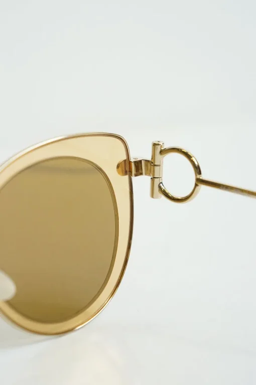 Salvatore Ferragamo gold cat eye sunglasses with circled metal temples