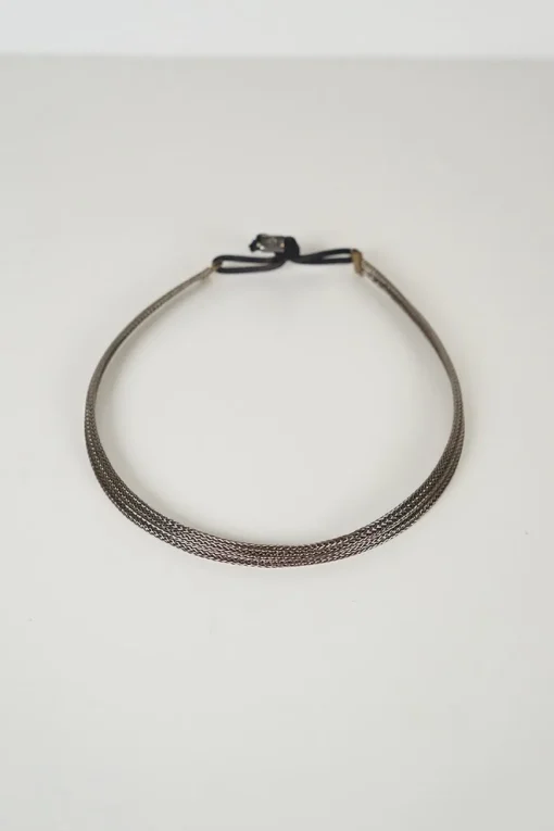 silver colour headband in braided hand shaped wire filament