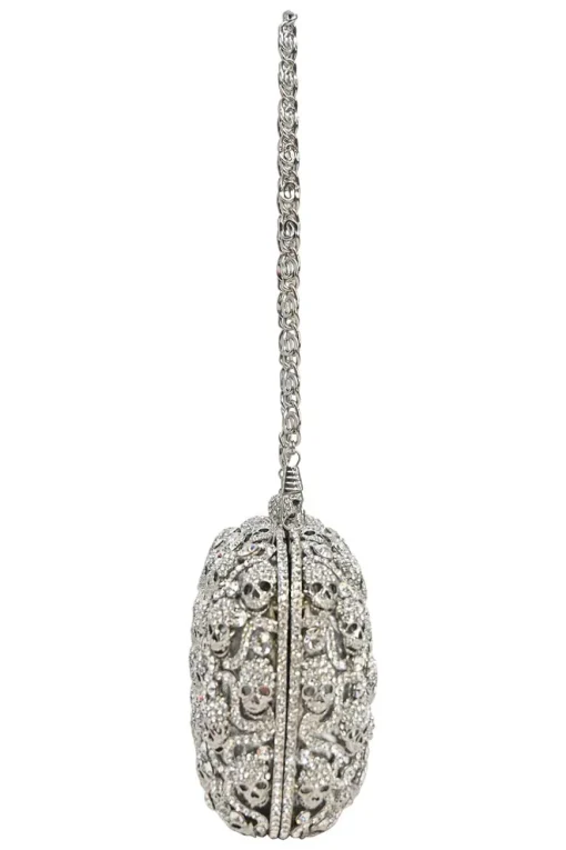 Silver crystal-embellished chain skull clutch with kiss lock fastening