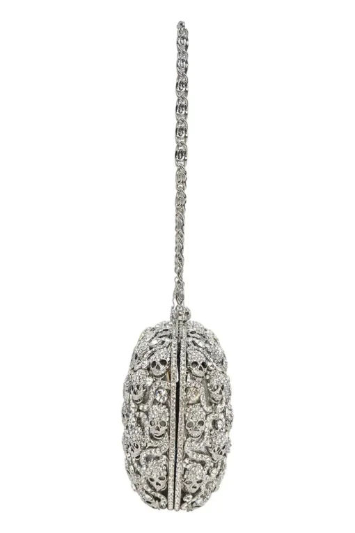 Silver crystal-embellished chain skull clutch with kiss lock fastening