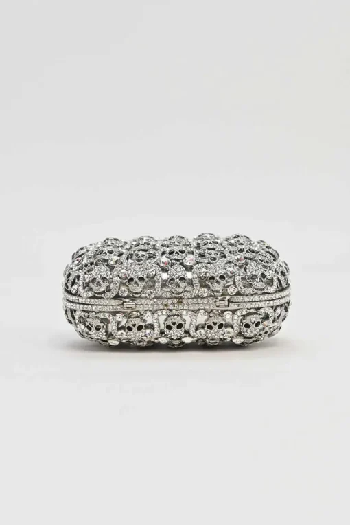 Silver crystal-embellished chain skull clutch with kiss lock fastening