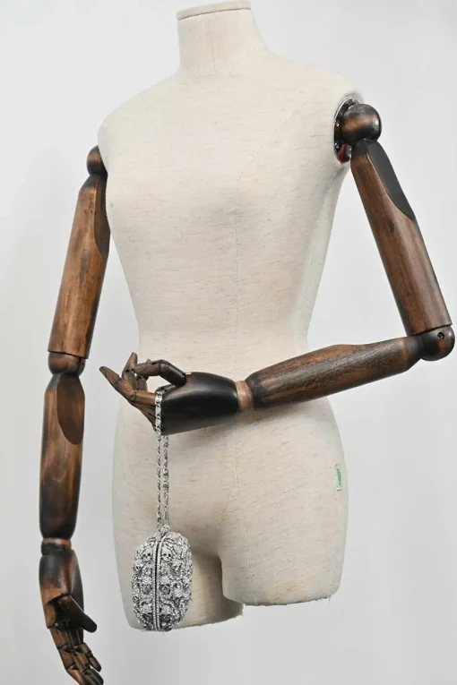 Silver crystal-embellished chain skull clutch with kiss lock fastening