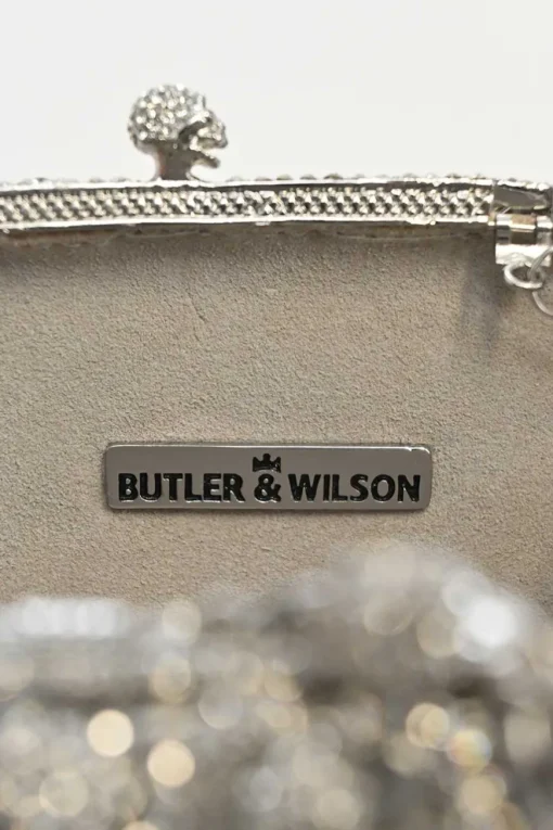 Silver crystal-embellished chain skull clutch with kiss lock fastening