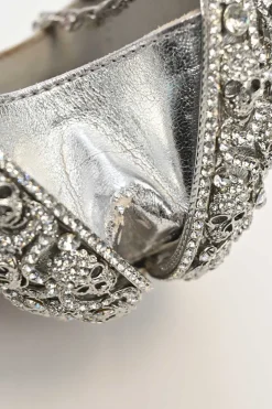 Silver crystal-embellished chain skull clutch with kiss lock fastening