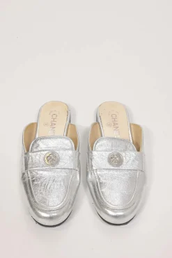 Silver foiled leather round-toe slip-on mules with camellia medallion appliqué