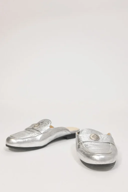 Silver foiled leather round-toe slip-on mules with camellia medallion appliqué
