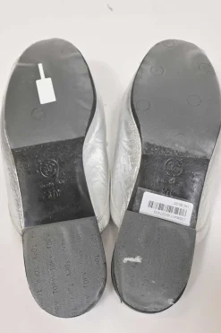 Silver foiled leather round-toe slip-on mules with camellia medallion appliqué