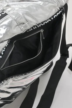 Silver foiled ripstop rucksack featuring branded sealed zipper tape and adjustable jacquard shoulder straps