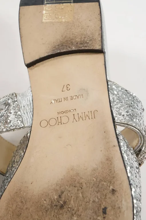 Silver glitter-bonded leather slip-on Gee mules with crystal-embellished mid-arch vamp strap