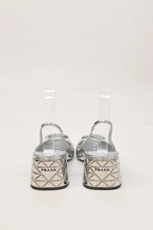 Silver mirrored leather slingback pumps with faceted logo vamp plaque and mirrored block heels