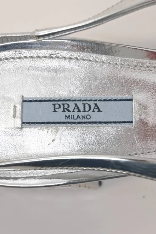 Silver mirrored leather slingback pumps with faceted logo vamp plaque and mirrored block heels