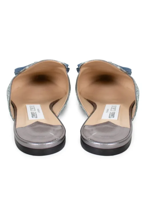Silver with turquoise painted coarse glitter 'Galaxy' point-toe mules decorated with bow