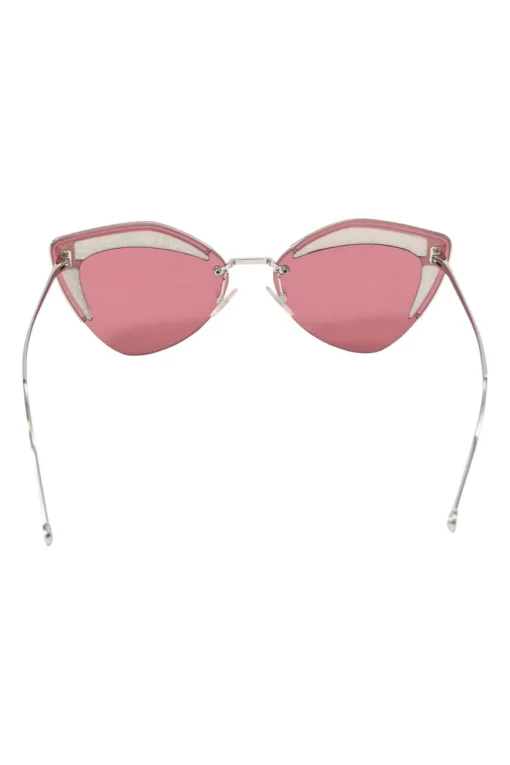 Silver-tone metal and pink tinted polycarbonate rimless cat-eye sunglasses with glitter accents