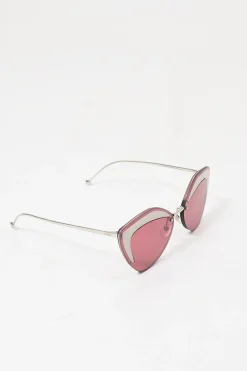 Silver-tone metal and pink tinted polycarbonate rimless cat-eye sunglasses with glitter accents