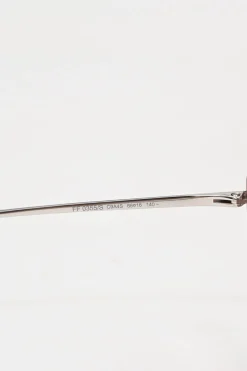 Silver-tone metal and pink tinted polycarbonate rimless cat-eye sunglasses with glitter accents