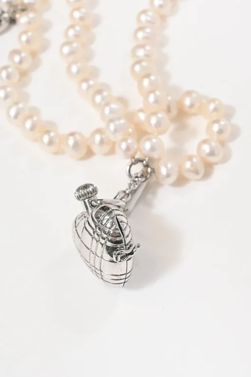 Silver-tone metal and resin faux pearl heart watch locket bracelet with T-bar closure