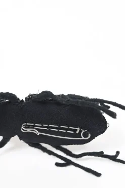 Strass-embellished black yarn-wrapped wire beetle brooch