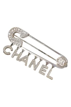 Strass-embellished silver-finish metal logo charm safety pin brooch
