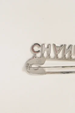 Strass-embellished silver-finish metal logo charm safety pin brooch