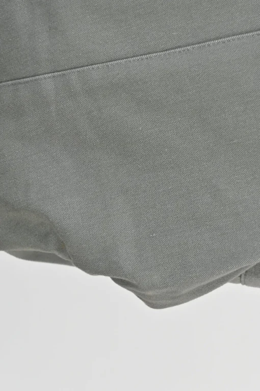 Taupe grey cotton-blend pull-on mid-rise slacks with zip detail along cuffs