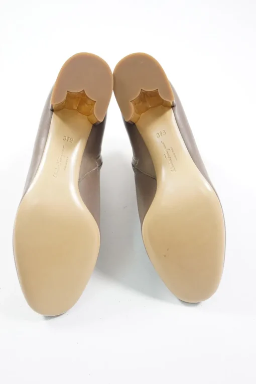 Taupe polished calfskin almond toe zip-up ankle booties with scalloped block heel