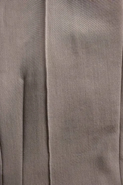 Taupe polyester-wool blend crêpe darted pintuck trousers with fold over hem
