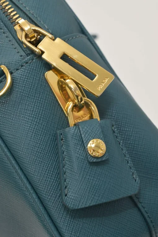 Teal Saffiano leather Vitello Daino rectangle bowler bag with detachable shoulder strap