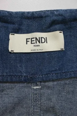 True indigo cotton denim paper-bag waist tapered leg pants with snap buckle belt and tab cuffs