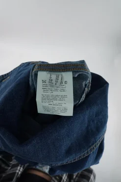 True indigo cotton denim funnel collar button-front darted coveralls with chest patch pocket