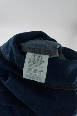 True indigo cotton denim funnel collar button-front darted coveralls with chest patch pocket