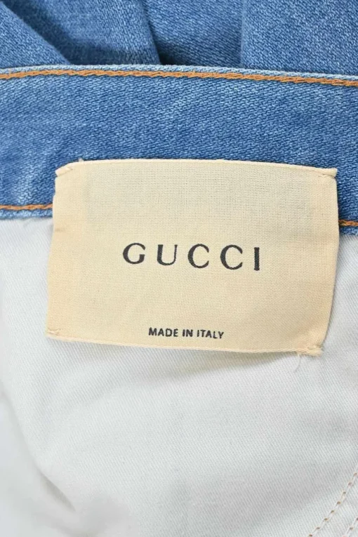 True indigo cotton-blend denim pull-on low-rise flared jeans featuring side seam webbing detail