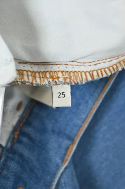 True indigo cotton-blend denim pull-on low-rise flared jeans featuring side seam webbing detail