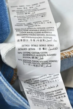True indigo cotton-blend denim pull-on low-rise flared jeans featuring side seam webbing detail