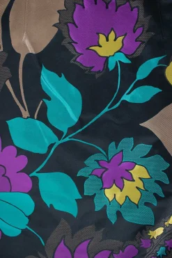 Two piece jacket &amp; skirt suit in silk blend in black with flower jacquard pattern. Cropped single button jacket with small patch pockets