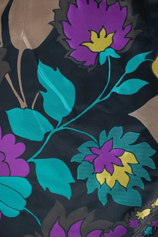 Two piece jacket &amp; skirt suit in silk blend in black with flower jacquard pattern. Cropped single button jacket with small patch pockets