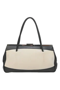 Two-tone canvas and leather frame shoulder bag with metallic push-lock closure