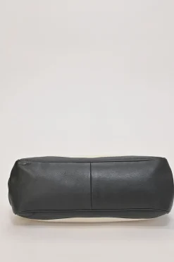 Two-tone canvas and leather frame shoulder bag with metallic push-lock closure