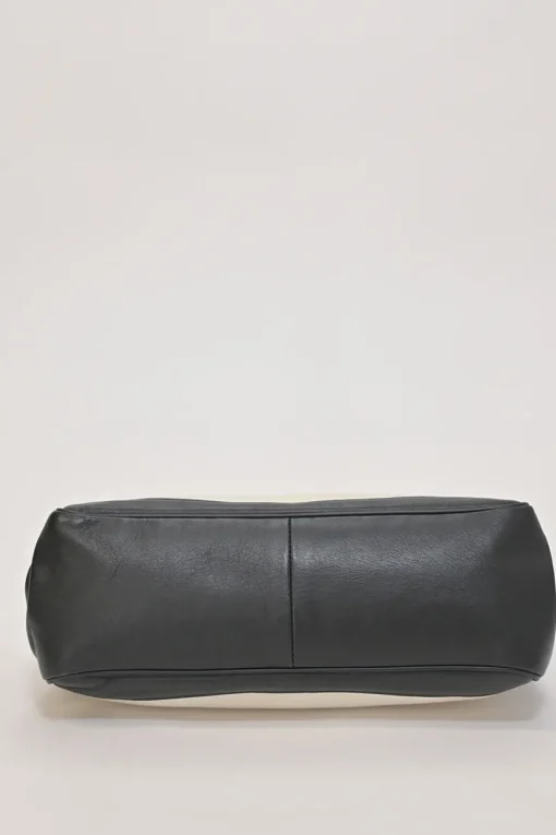 Two-tone canvas and leather frame shoulder bag with metallic push-lock closure
