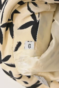 Two-tone halftone floral print two-piece set featuring spread collar button-front short sleeve jacket and mini pencil skirt