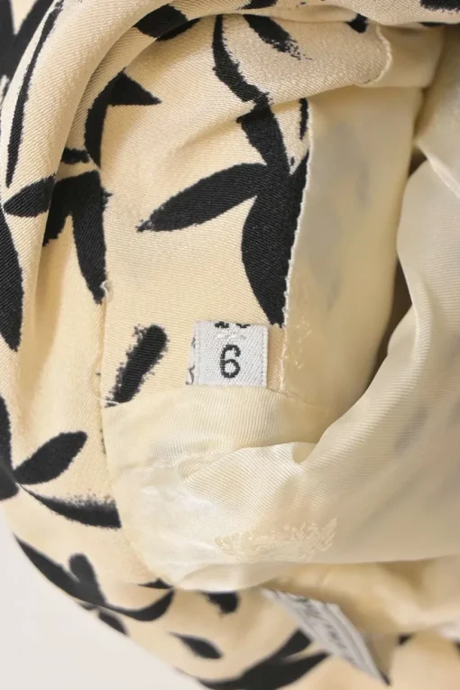 Two-tone halftone floral print two-piece set featuring spread collar button-front short sleeve jacket and mini pencil skirt