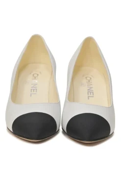 Two-tone leather and grosgrain pointed-toe cone heel pumps featuring metallic Coco Mark plaque appliqué