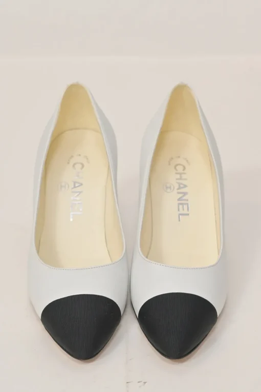Two-tone leather and grosgrain pointed-toe cone heel pumps featuring metallic Coco Mark plaque appliqué