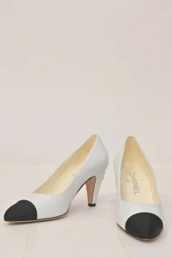 Two-tone leather and grosgrain pointed-toe cone heel pumps featuring metallic Coco Mark plaque appliqué