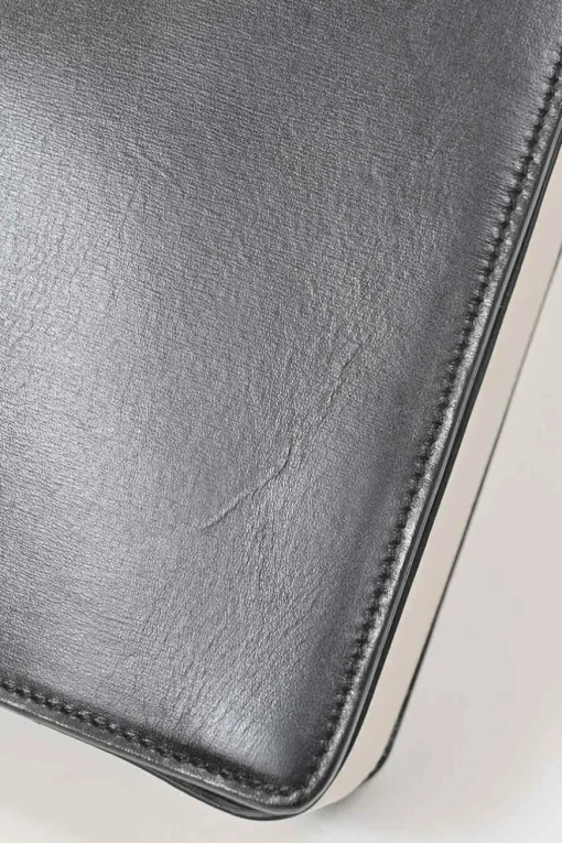 Two-tone leather top handle bag with turnlock fastening