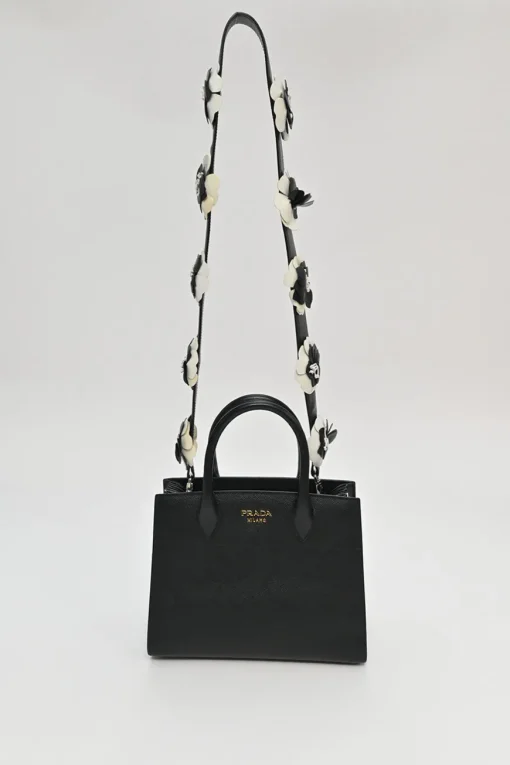 Two-tone Saffiano leather Bibliotheque bag with detachable black and white flower applique shoulder strap